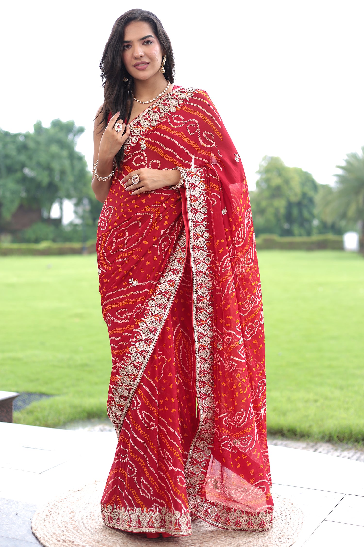 Popular Indian wedding party wear women georgatte bandhej print and gotta pati work party wear women saree